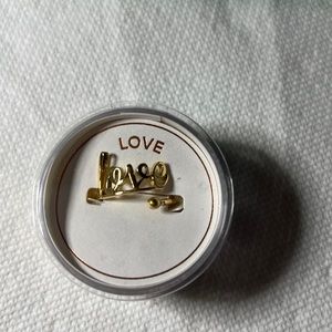 Alex and Ani “Love” ring in gold tone